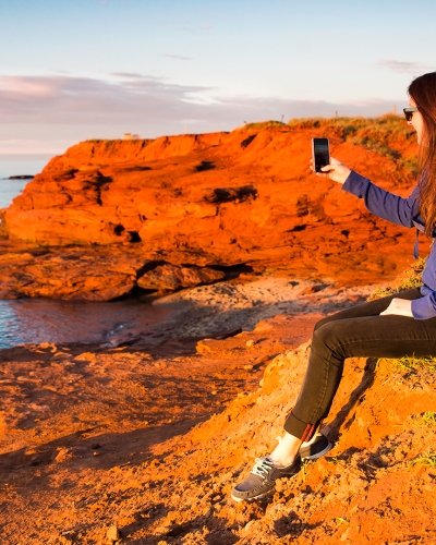 Cavendish Cliffs, woman taking picture