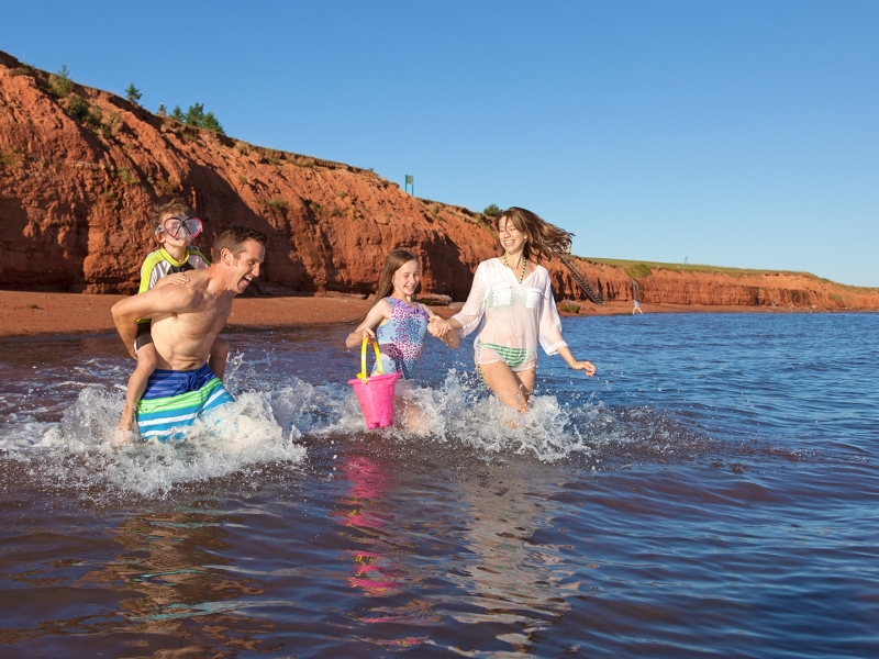 Argyle Shore, family playing in ocean