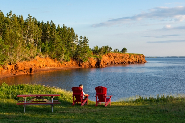 Port la Joye, wooden chairs, ocean view, forest