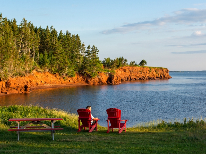 Port la Joye, wooden chairs, ocean view, forest