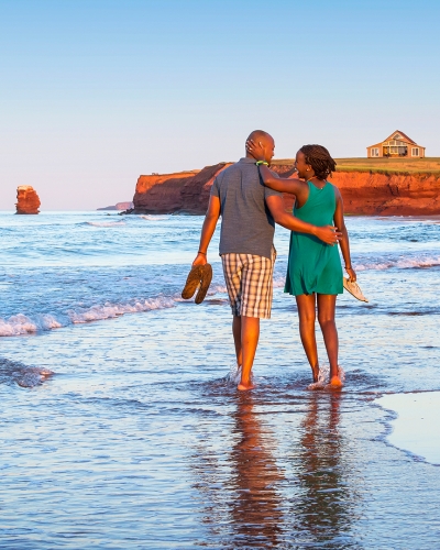 Sea View Beach, couple walking, back view, waves