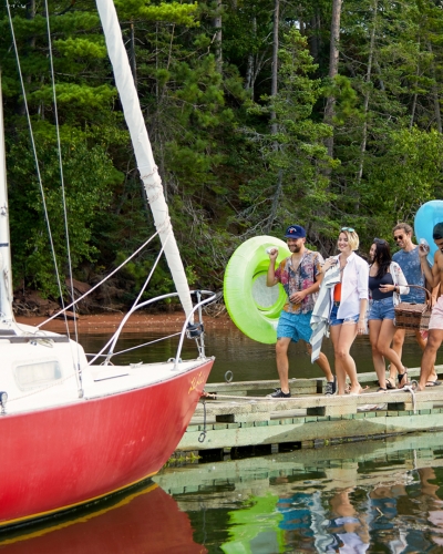 Boat, group of people, docks, inner-tubes