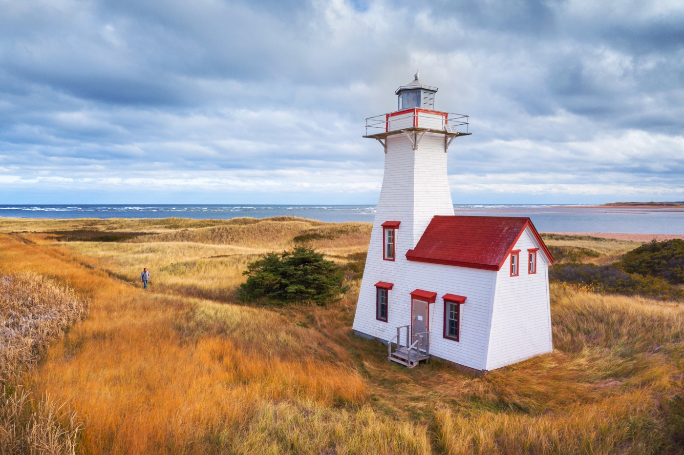 Aerial view of New London lighthouse with fall coloured grasses and light