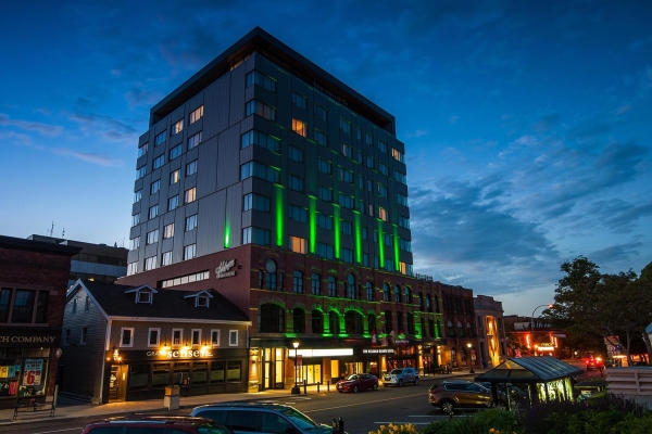 Exterior view of the Holman Grand Hotel lit up at night