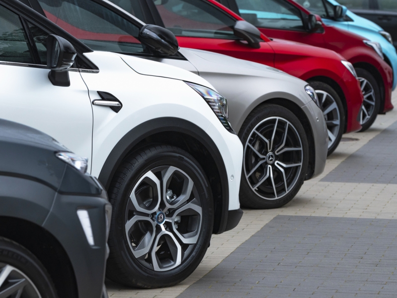 Stock image of cars parked in a row