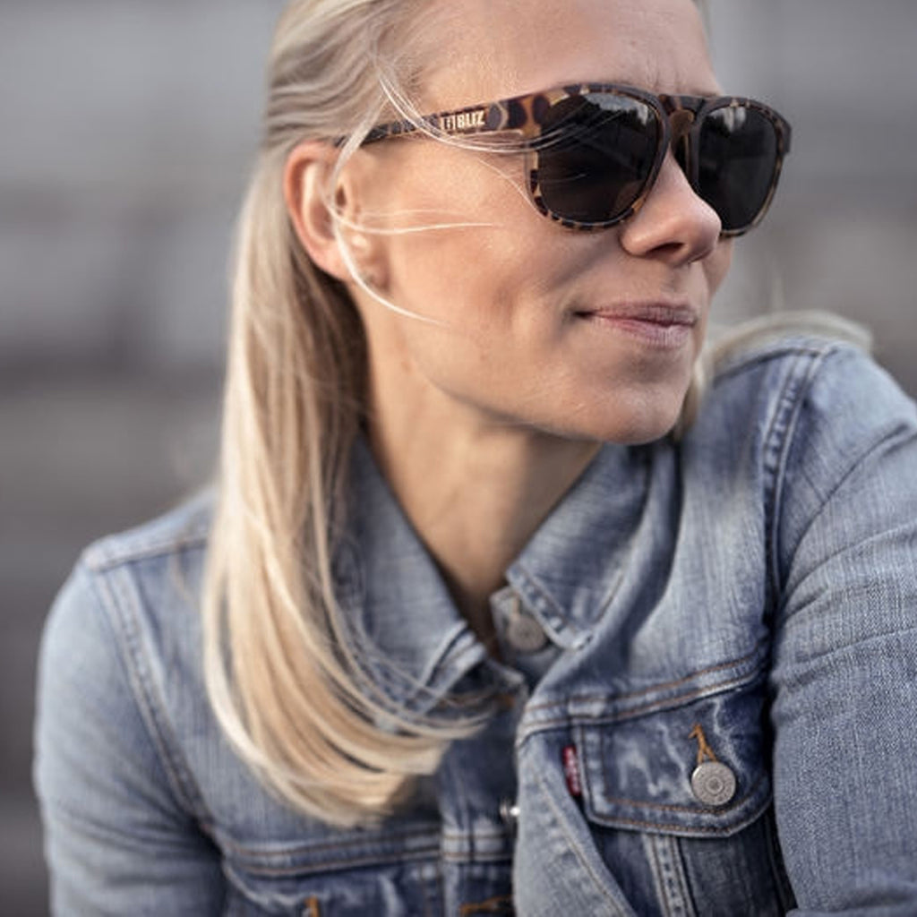 Girl wearing sunglasses with a tortoise shell frame