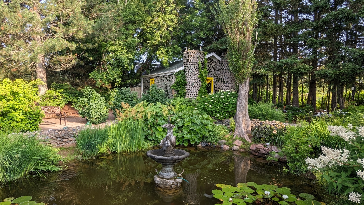 Chapel seen in distance with lilly pond in front