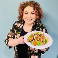 Ilona Daniel holding a plat of baked oysters