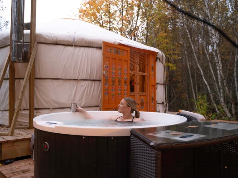 Female in hot tub with tub in background at Nature Space Eco Resort